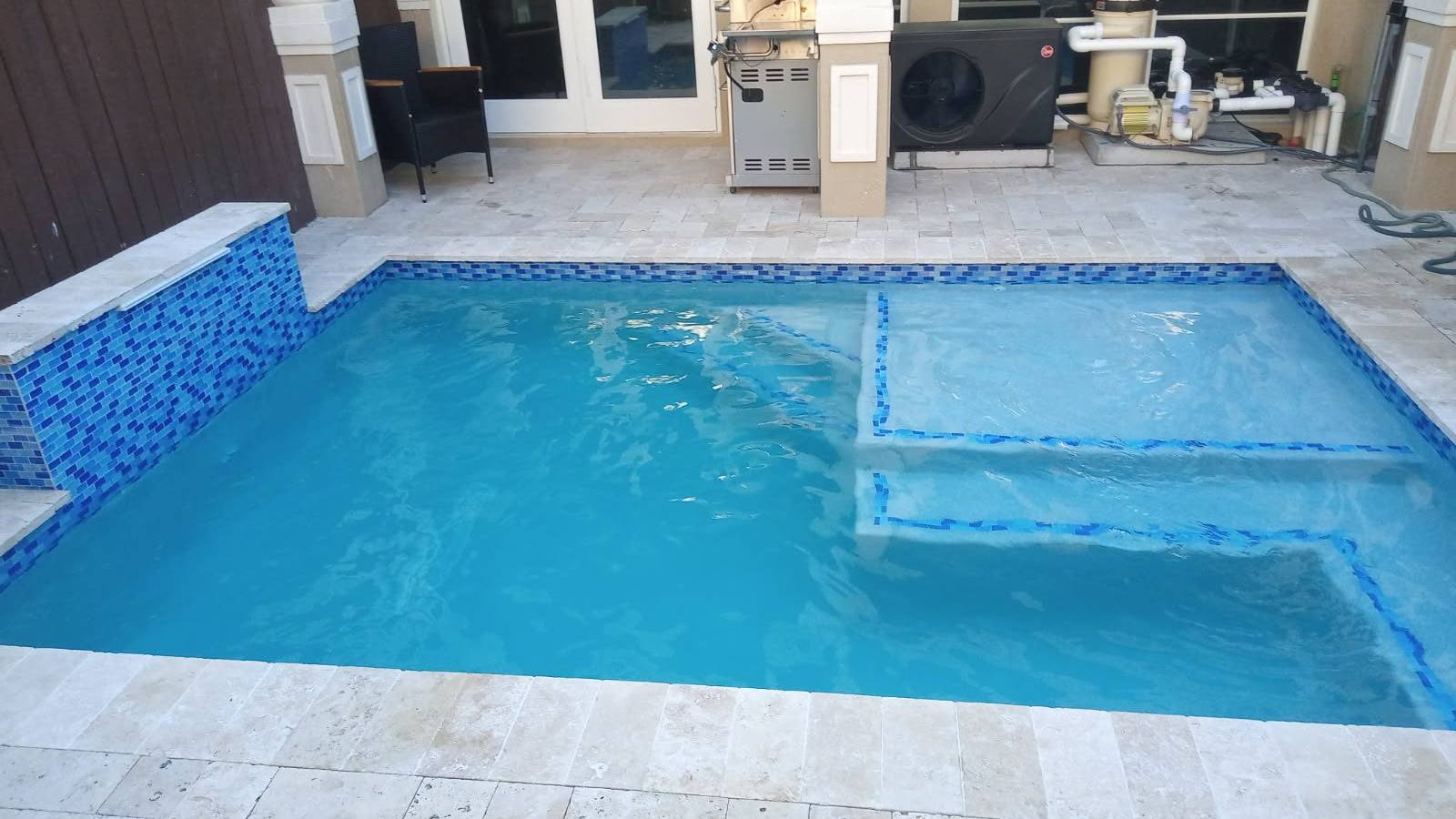 Custom pool and patio project by Cliff's Pools & Patios for Palm Beach Gardens, FL homeowners