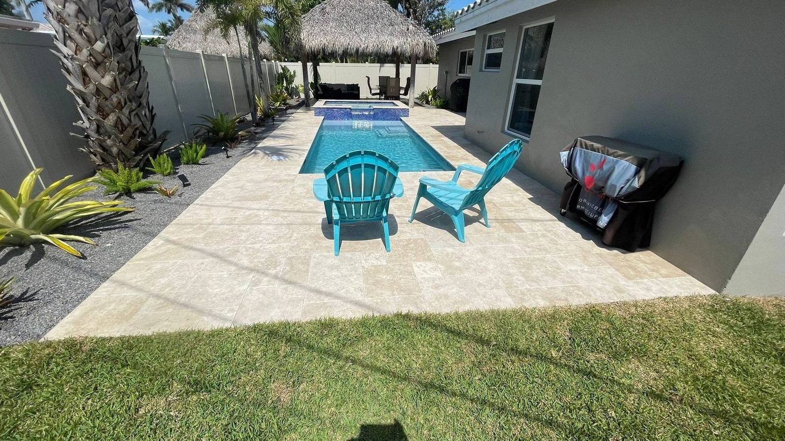 Custom pool and patio project by Cliff's Pools & Patios for Palm Beach Gardens, FL homeowners