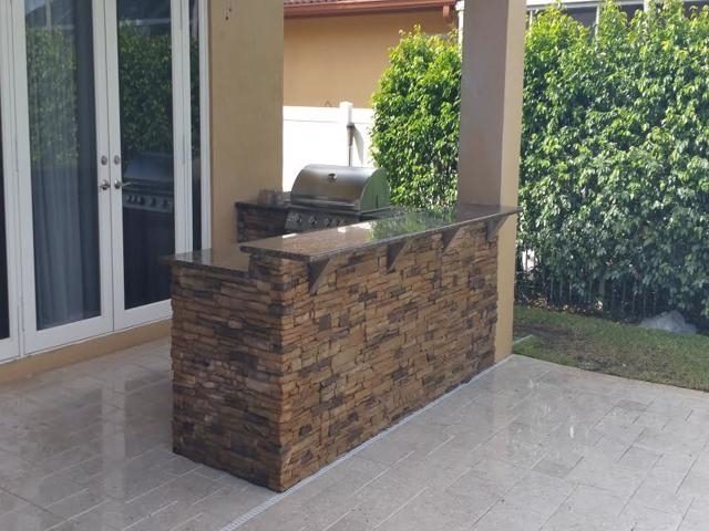 Cliff's Pools & Patios covered outdoor kitchen with clean lines