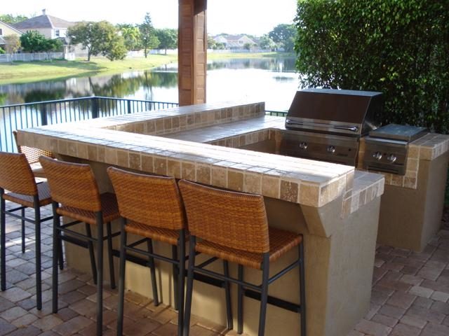 Cliff's Pools & Patios screened outdoor kitchen with granite bar