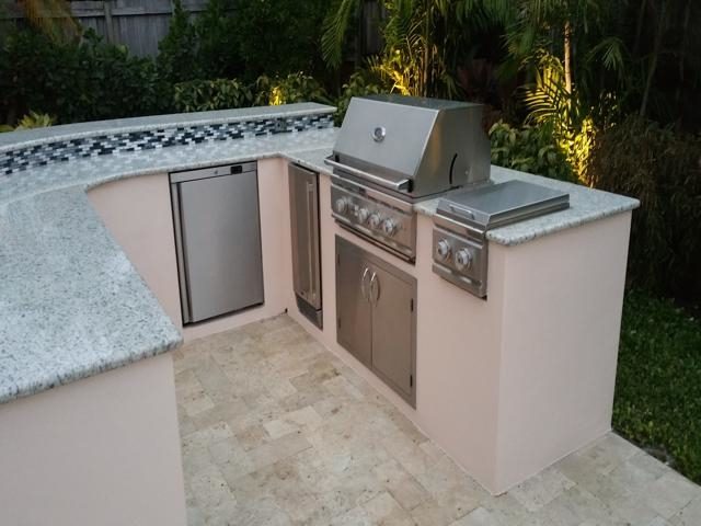 Cliff's Pools & Patios stainless outdoor kitchen with travertine deck