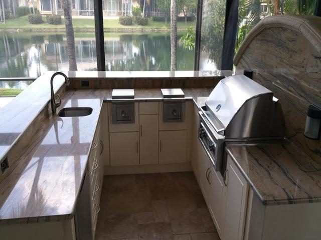 Cliff's Pools & Patios modern outdoor kitchen with pool view