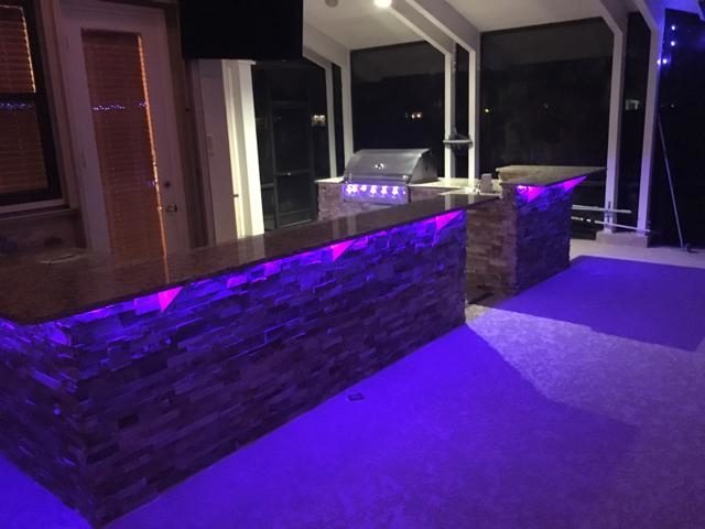 Cliff's Pools & Patios modern outdoor kitchen with LED accent lighting - serving Boynton Beach, FL