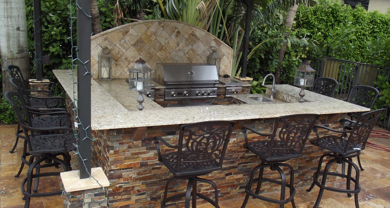 Cliff's Pools & Patios outdoor kitchen with stainless grill and granite bar - serving Sea Ranch Lakes, FL
