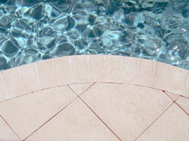 Cliff's Pools & Patios paver pool deck and patio